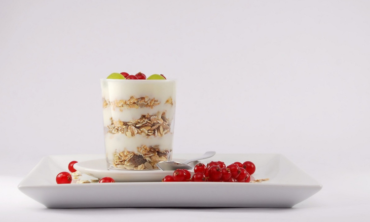 Yogurt with granola and fruit.